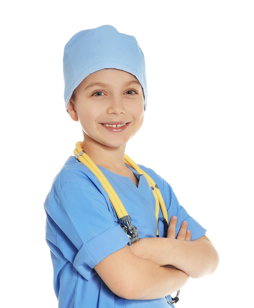 Cute little child in doctor uniform with stethoscope on white background - 写真・画像