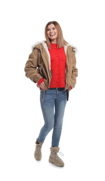 Young woman wearing warm clothes on white background. Ready for winter vacation - Foto, Imagen