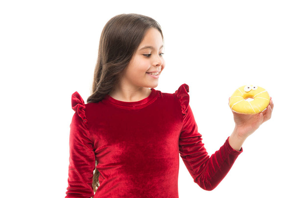 Sweet obsession. Happy childhood and sweet treats. Breaking diet concept. Girl hold sweet donut white background. Child hungry for sweet donut. Sugar levels and healthy nutrition. Nutritionist advice - Foto, Imagem