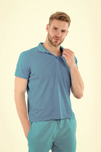 Bearded man in blue casual clothes isolated on white. Man in tshirt and shorts isolated on white. Macho in active wear for workout or training. Sport fashion style and trend. Fitness and gym activity - Φωτογραφία, εικόνα