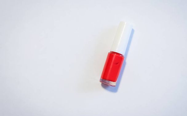 bottle of red nail Polish on white background - Valokuva, kuva