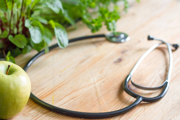 Stethoscope and herbs  healthy life style and alternative medicine background concept - Valokuva, kuva