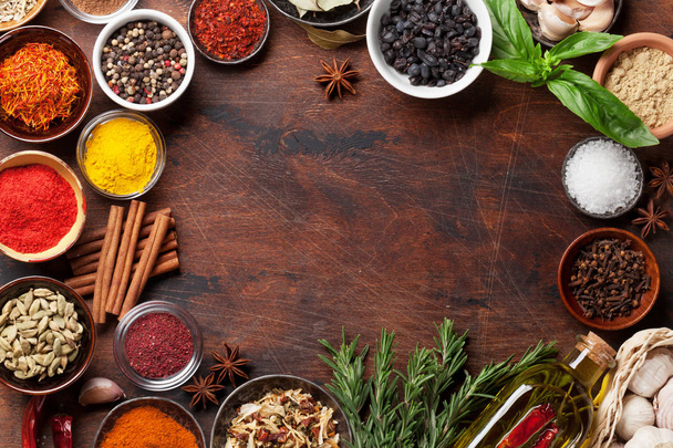 Set of various spices and herbs on wooden background. Top view with space for your recipe. Flat lay - Photo, Image