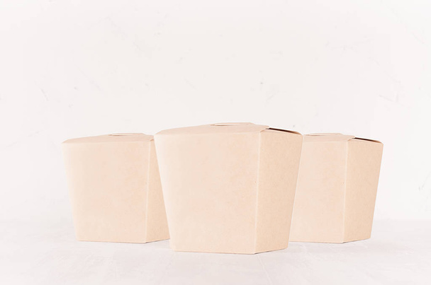 Set of three cardboard box for noodles, fast food on white wooden board, closeup, concept design pack for go food for restaurant, cafe, shop, advertising. - Foto, Bild