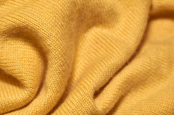 Macro photo of fabric pattern, close up of textile clothing with shallow depth of field. Soft blurred material background - Photo, image
