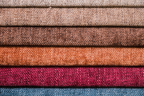 Colorful and bright fabric samples of furniture and clothing upholstery. Close-up of a palette of textile abstract stripes of different colors - Foto, immagini