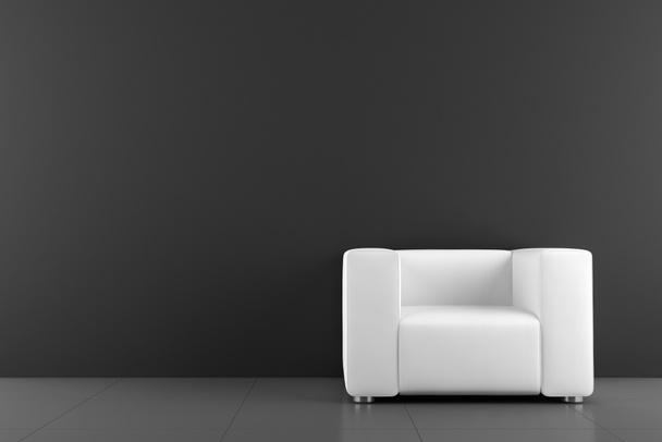 White armchair in front of black wall - Foto, Bild