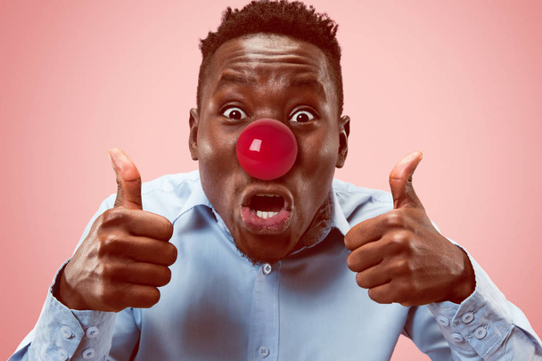 Happy afro man on red nose day. - Foto, Imagem