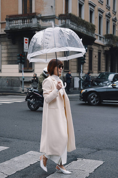 Milan, Italy - February 22, 2018: Fashionable appearances of influencers during Milan Fashion Week. - 写真・画像