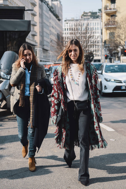 Milan, Italy - February 21, 2018: Fashion girl posing to photographers during Milan Fashion Week AW 2018. - Photo, image