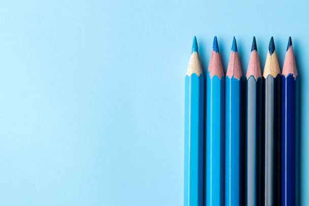 composition with blue pencils on a bright blue background. close-up. place for text. top view - Φωτογραφία, εικόνα