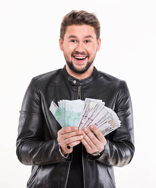 Business, people and finances concept.  Smiling businessman with american dollar and euro money on a white background - Photo, Image