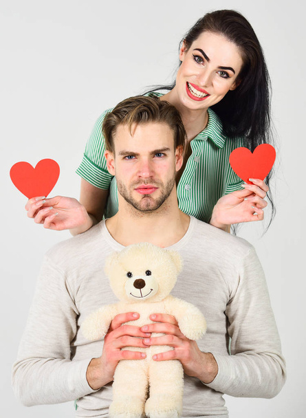 Man and woman couple in love hold red heart valentines cards white background. Man and pretty girl in love. Valentines day concept. Valentines day and love. Romantic ideas celebrate valentines day - Zdjęcie, obraz