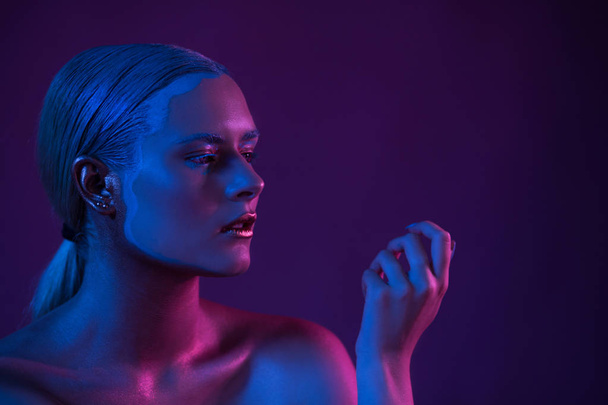 Blue Purple Portrait of Sexy Naked Model in Neon Light on Dark Background - Photo, Image