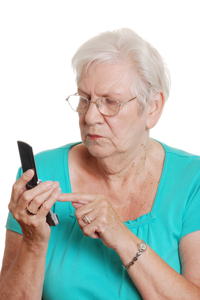 Senior woman dialing number cell phone - Valokuva, kuva