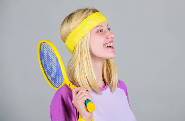 Athlete hold tennis racket in hand. Tennis club concept. Active leisure and hobby. Tennis sport and entertainment. Girl adorable blonde play tennis. Start play game. Sport for maintaining health - Foto, Imagem