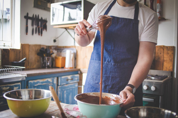 Close up image of a chef stirring cake batter for baking a cake. - Foto, Imagem