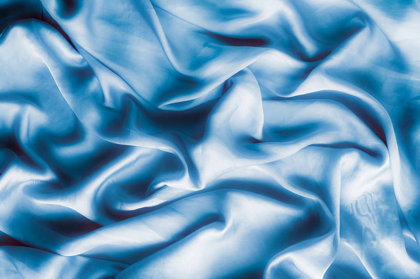 Blue soft silk waves, flatlay - elegant fabric textures, abstract backgrounds and modern pastel colours concept. Feel the touch of luxury - Photo, Image