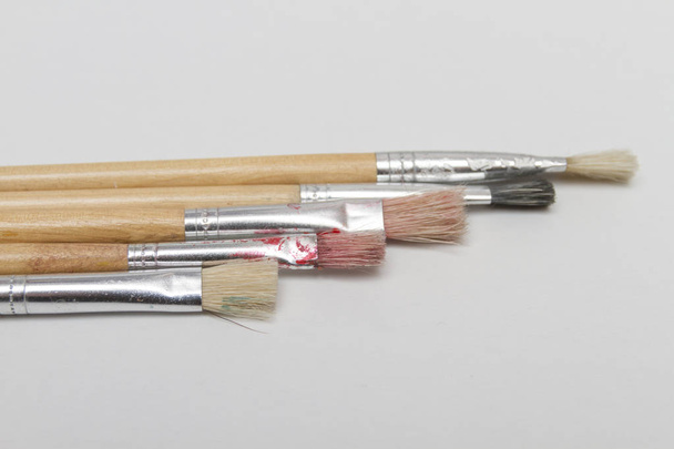 Close up of paintbrushes on white background - Photo, Image