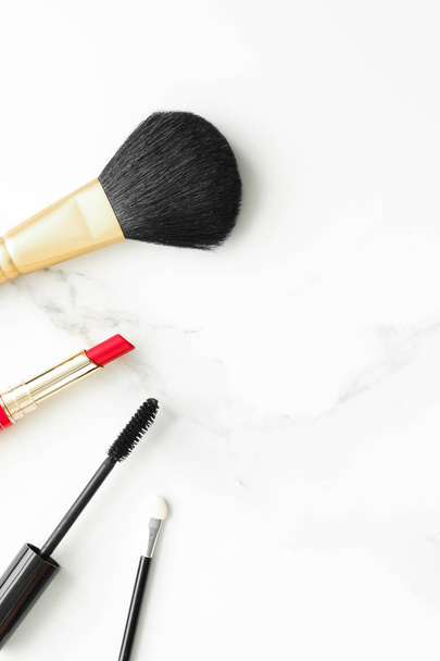 Make-up and cosmetics on marble, flatlay - modern feminine lifestyle, vlog background and styled stock concept. Beauty inspiration in a fashion blog - Photo, Image