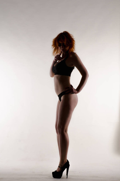 Nude redhead girl in sexy black underwear - Fotoğraf, Görsel