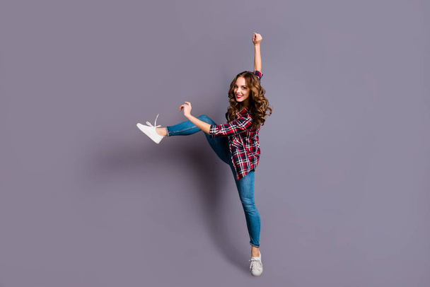 Full length size body view photo of fly high attractive beautiful she her lady modern  dance queen very flexible wearing casual jeans denim checkered plaid shirt on grey background - Foto, immagini