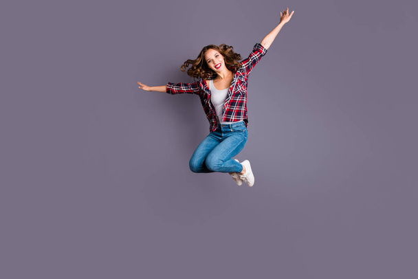 Full length body size view portrait of her she nice attractive adorable sporty lovely charming pretty cheerful cheery wavy-haired lady free time life like plane isolated over gray background - Foto, afbeelding