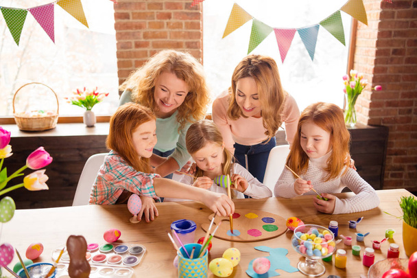 Portrait of nice cute attractive lovely sweet winsome cheerful girls making decor cool stylish things on table for event gift present in house brick loft industrial interior room - 写真・画像