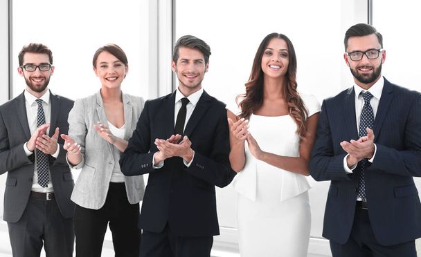 business team applauding while standing in the office - Photo, image