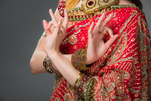 cropped view of indian woman in traditional clothing showing gyan mudra, isolated on grey  - Fotografie, Obrázek