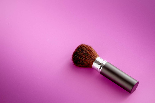 Makeup brush on Pink Pastel paper texture background. Pastel color , Minimal and Valentine concept. Copy space - Fotoğraf, Görsel