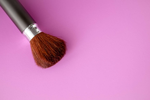 Makeup brush on Pink Pastel paper texture background. Pastel color , Minimal and Valentine concept. Copy space - Foto, imagen