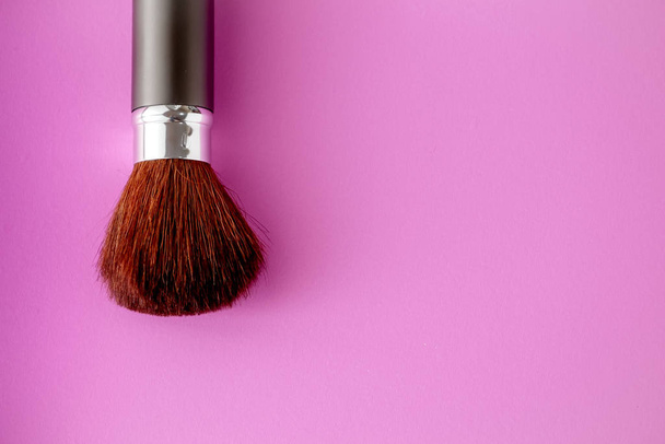 Makeup brush on Pink Pastel paper texture background. Pastel color , Minimal and Valentine concept. Copy space - Φωτογραφία, εικόνα