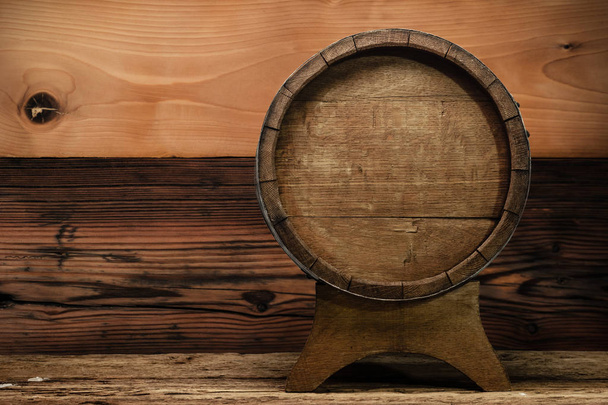 Wooden barrel and worn old table of wood. - Photo, Image