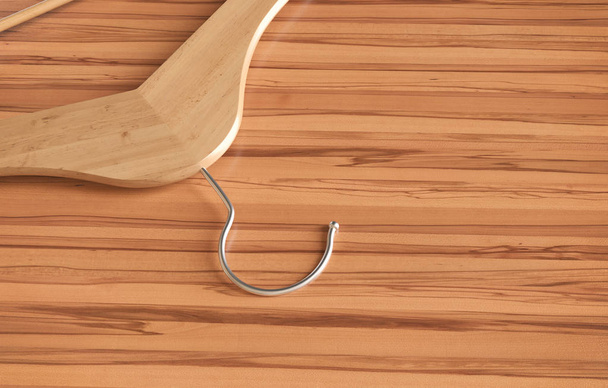 Wooden clothes hanger on table -- 3D Rendering - Фото, изображение