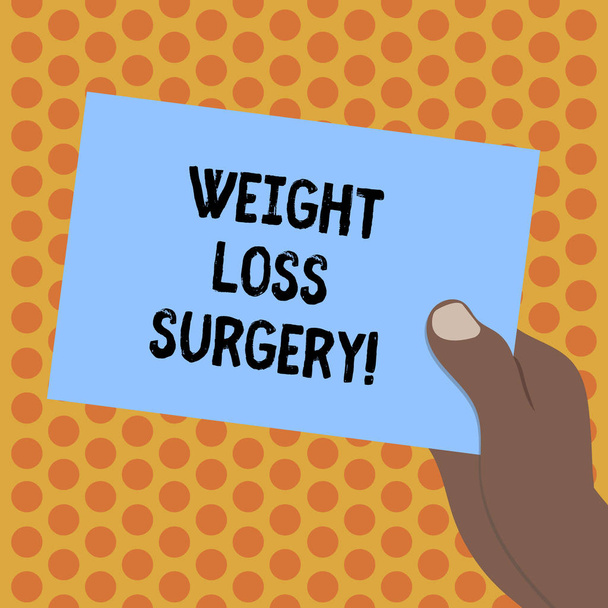 Writing note showing Weight Loss Surgery. Business photo showcasing do on stomach intestines to help demonstrating extreme obesity Drawn Hu analysis Hand Holding Blank Color Paper Cardboard. - Photo, Image