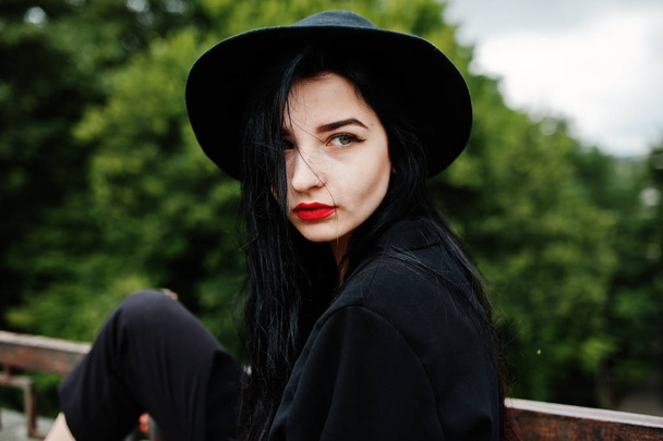 Sensual girl all in black, red lips and hat. Goth dramatic woman.  - Фото, зображення