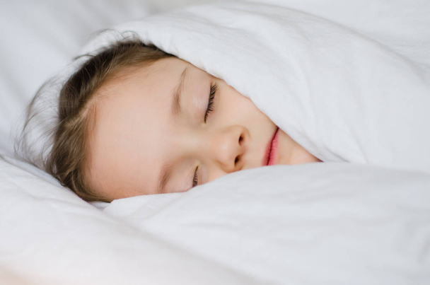 Sleeping child girl in the morning. Close up - Foto, immagini
