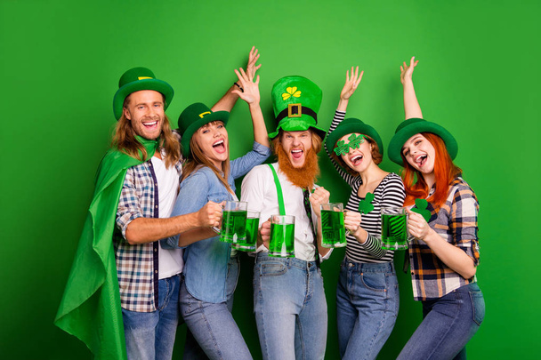 Portrait of nice cool crazy attractive cheerful cheery positive people guys ladies in trendy stylish look costumes clinking jar craft beer rising hands up isolated over bright vivid shine background - Fotoğraf, Görsel
