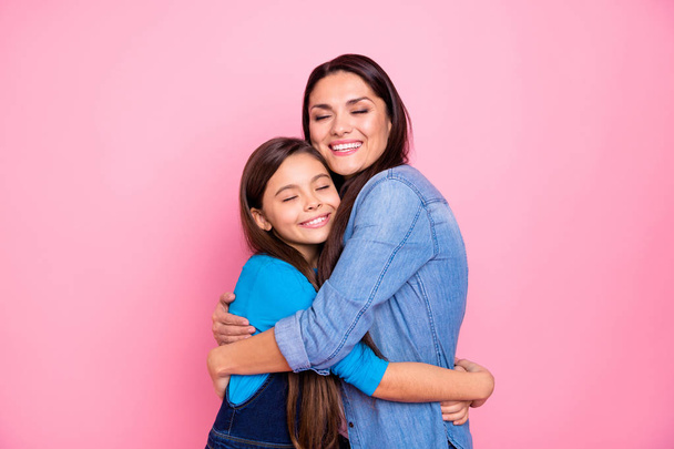 Portrait of two nice cute adorable sweet winsome lovely attractive charming cheerful cheery positive girls hugging care trust feelings isolated over pink pastel background - Фото, изображение