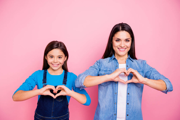 Portrait of two nice stylish trendy cute winsome pretty lovely attractive charming cheerful positive straight-haired girls showing healthy heart health isolated over pink pastel background - Φωτογραφία, εικόνα