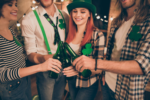 Close up photo company together st paddy day leprechaun costumes telling toast irish tradition culture carefree guys best weekend vacation hands raise beer bottles festive - Photo, Image