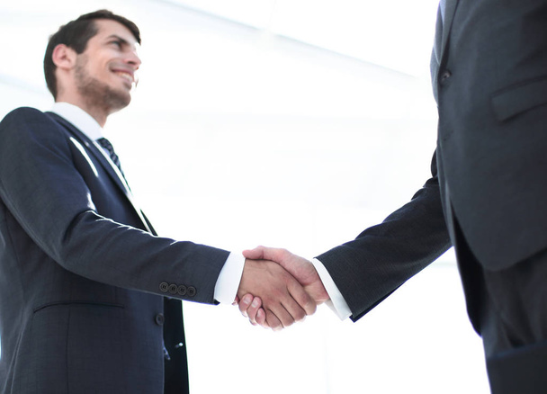 handshake of business partners on a light background. - Photo, Image