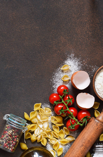 Ingredients for cooking pasta. Kitchen process. Top view with space for text. - Φωτογραφία, εικόνα