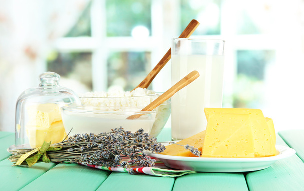 Glass of milk and cheese on bright background - Φωτογραφία, εικόνα