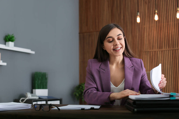 Beautiful businesswoman working with documents at table in office. Space for text - Photo, Image