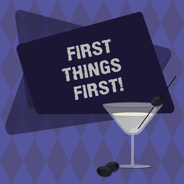 Conceptual hand writing showing First Things First. Business photo text important matters should dealt with before other things Filled Cocktail Wine Glass with Olive on the Rim Text Space. - Photo, Image