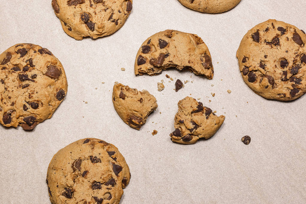Homemade chocolate chip cookies on a light kitchen table. Top view flat lay background. - Photo, Image