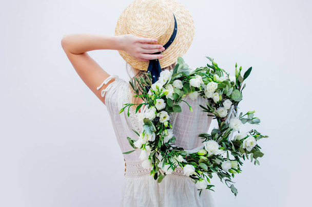 Beautiful woman with white roses wreath on white background - Valokuva, kuva