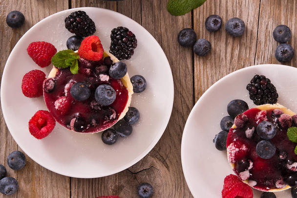Cheesecakes with mixed berries. - Φωτογραφία, εικόνα